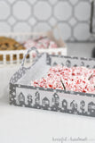 Close-up of the vellum in between the sides of the Christmas village cookie tray.