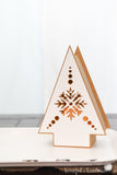 Close up photo of one of the DIY Christmas lanterns with Nordic snowflake design on it.
