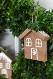 Closeup of gingerbread house ornaments made out of upcycled brown grocery bags.