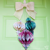 Decorate your door with this beautiful DIY giant paper ornament Christmas wreath. Fun and easy to make! | Housefulofhandmade.com