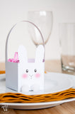 These boxes are the cutest! Celebrate Easter by filing these free printable bunny Easter baskets with your favorite treat. They are perfect for table settings and gifts. | Housefulofhandmade.com
