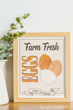 Farm fresh eggs farmers market sign in a maple frame on a table.