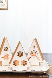 Hygge paper Christmas lanterns in the shape of a Christmas tree on a tray.