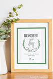 Reindeer Feed Co. printable Christmas sign in a frame.