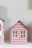 Close up of the small house in the Scandinavian paper Christmas village.