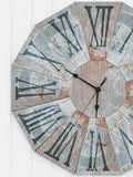 Close-up view of the texture on the rusted steel clock made out of paper.