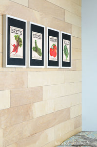 Four art prints that look like vegetable seed packets.